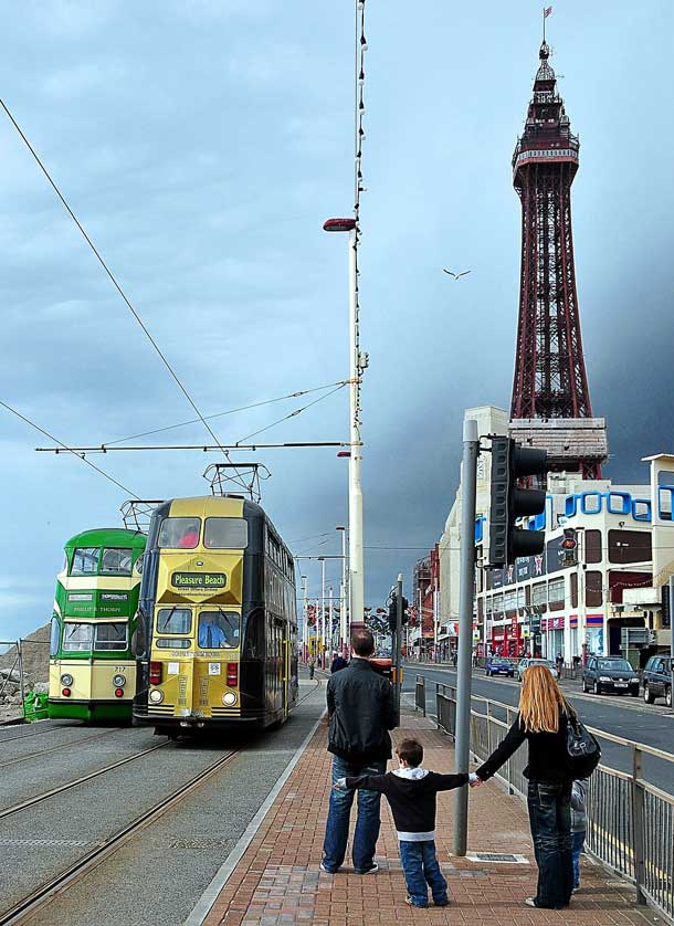 Trams stop outside the attraction.