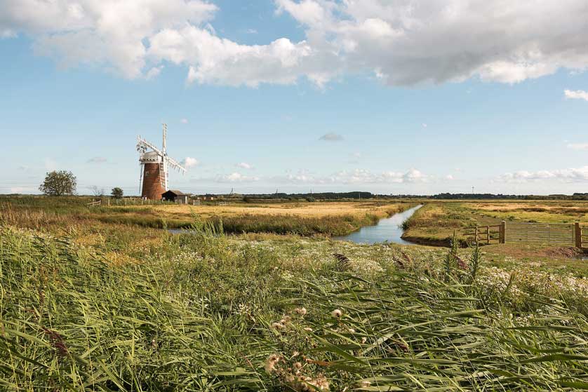 Windmill, fenland landscape of East Anglia, UK.
