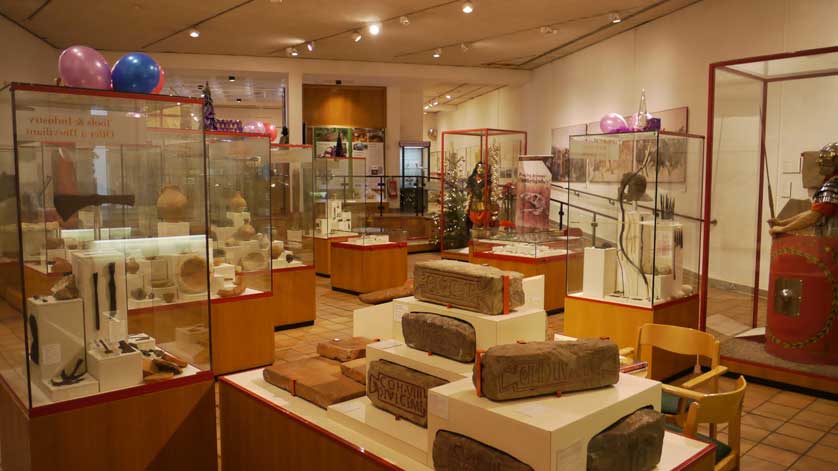 Exhibits include pottery and Roman stonework.