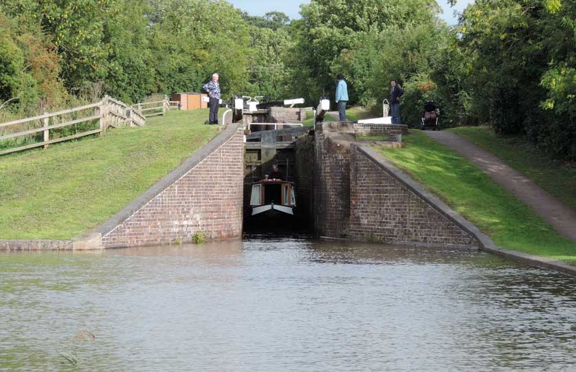 Canal boat emerging from lock, UK.