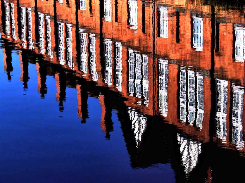 The Cash's Topshop reflected in the Coventry Canal.