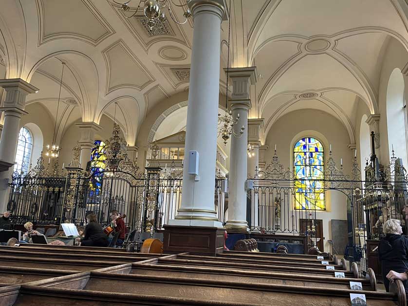 The interior of Derby Cathedral with its 18th century rood screen.