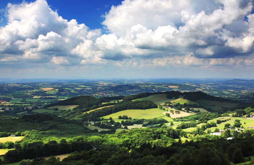 Malvern Hills, England showing a patchwork of woodlands and fields interspersed with linear hedgerows.
