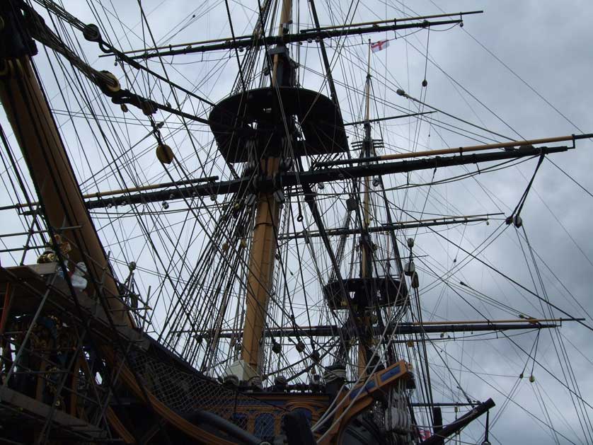 The complex rigging and masts of HMS Victory in Portsmouth Harbour.