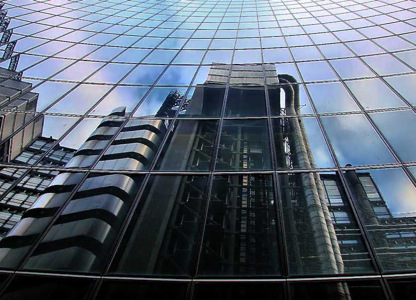 The Lloyd's Building reflected in one of the neighbouring glass towers.