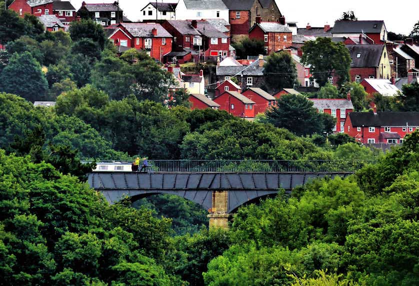 Viewed from the northern side, a narrowboat crossed the Pontcysyllte Aqueduct.