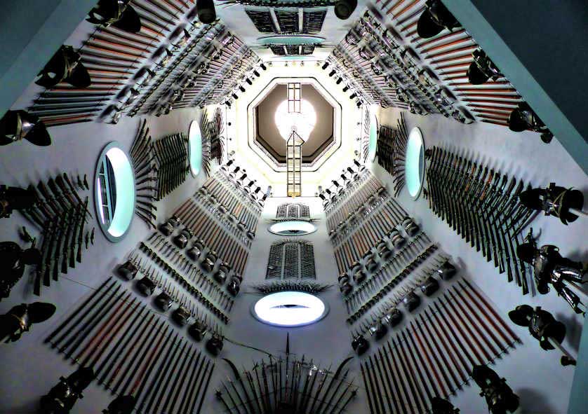The Hall of Steel is a massive display of trophy arrangements lining the interior stairwell of the Royal Armouries Museum.