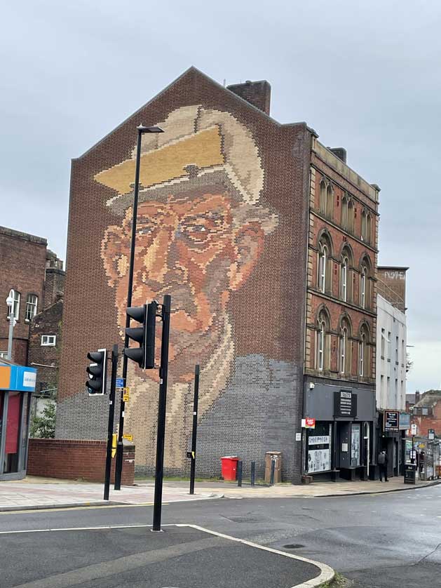 Brick mural of a steelworker on Castle Street, Sheffield.