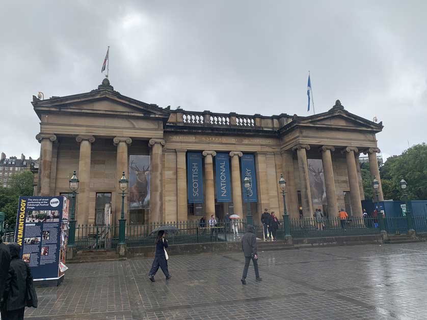 The gallery displays both paintings and sculpture.