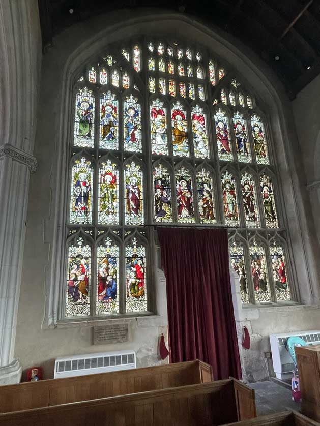 The stained glass in the huge west window dates from 1908.