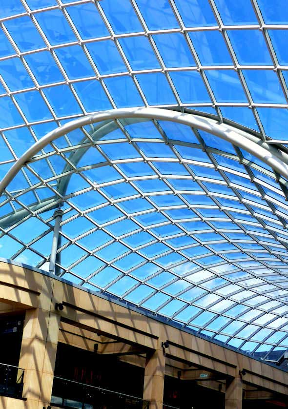 A massive glass roof covers the Trinity Shopping Center in Leeds.