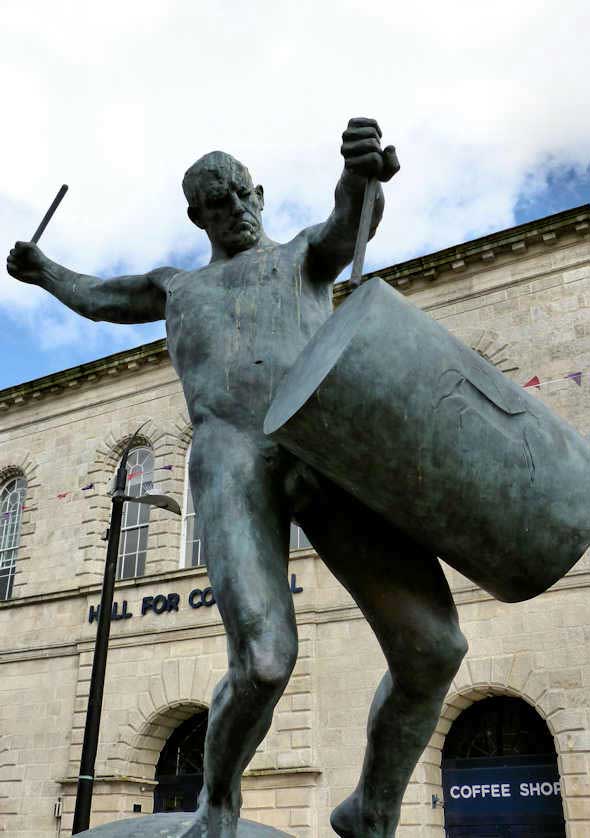 On Lemon Quay in Truro the 15ft high bronze statue of a naked man drumming.