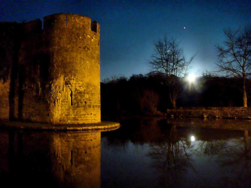 Moon-rise over the moat of the Bishop's palace in Wells, Somerset.